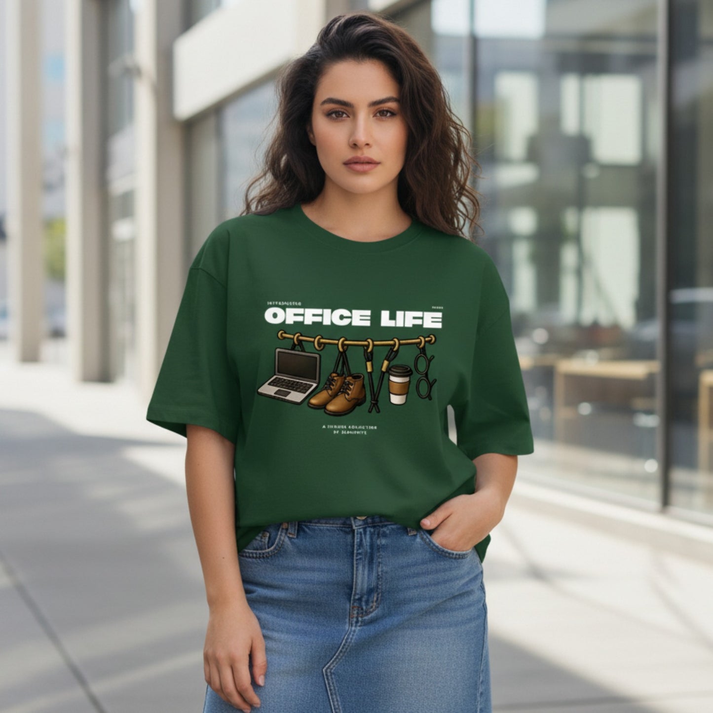 Woman wearing a green t-shirt with 'OFFICE LIFE' graphic design outdoors.