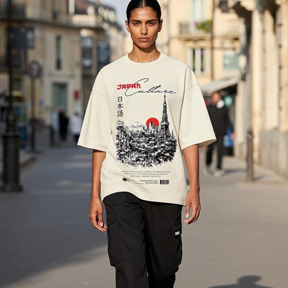 Person wearing a t-shirt with a graphic design on a city street