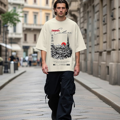 Man wearing a t-shirt with a graphic design walking down a city street.