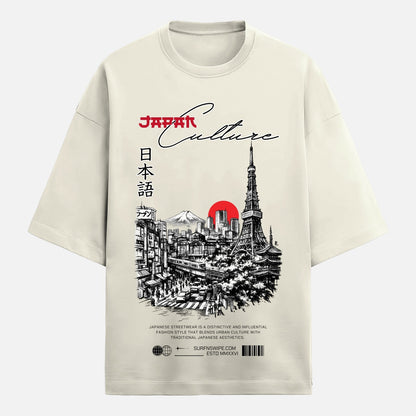 Beige t-shirt with a graphic design of the Eiffel Tower and Japanese text on a white background