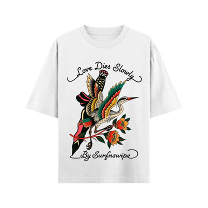 White t-shirt with a colorful bird design and text on a white background