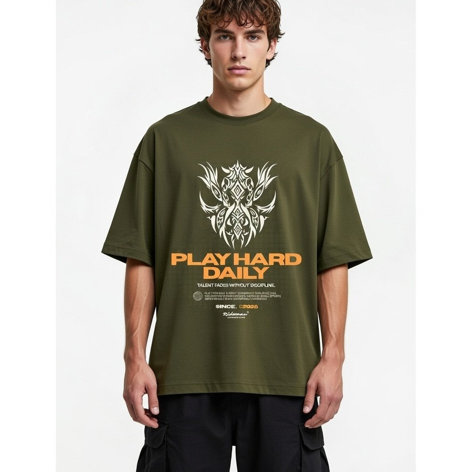 Man wearing a green t-shirt with a graphic design and text on a white background