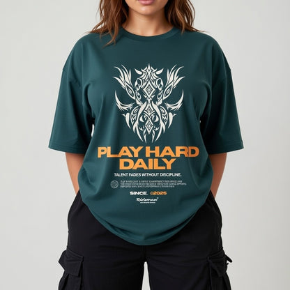 Person wearing a green t-shirt with a graphic design and text on a plain background