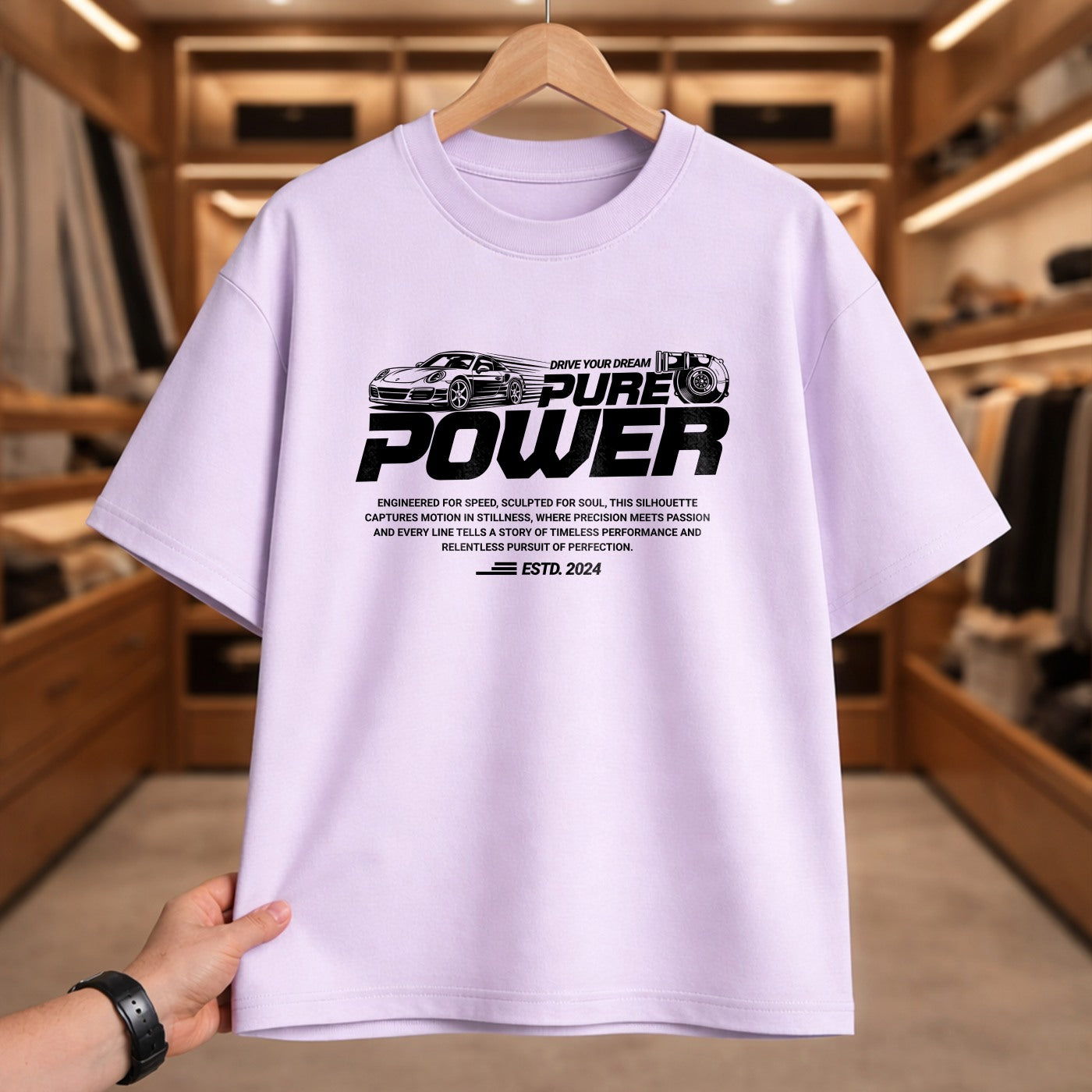 White t-shirt with black graphic and text on a hanger in a store setting