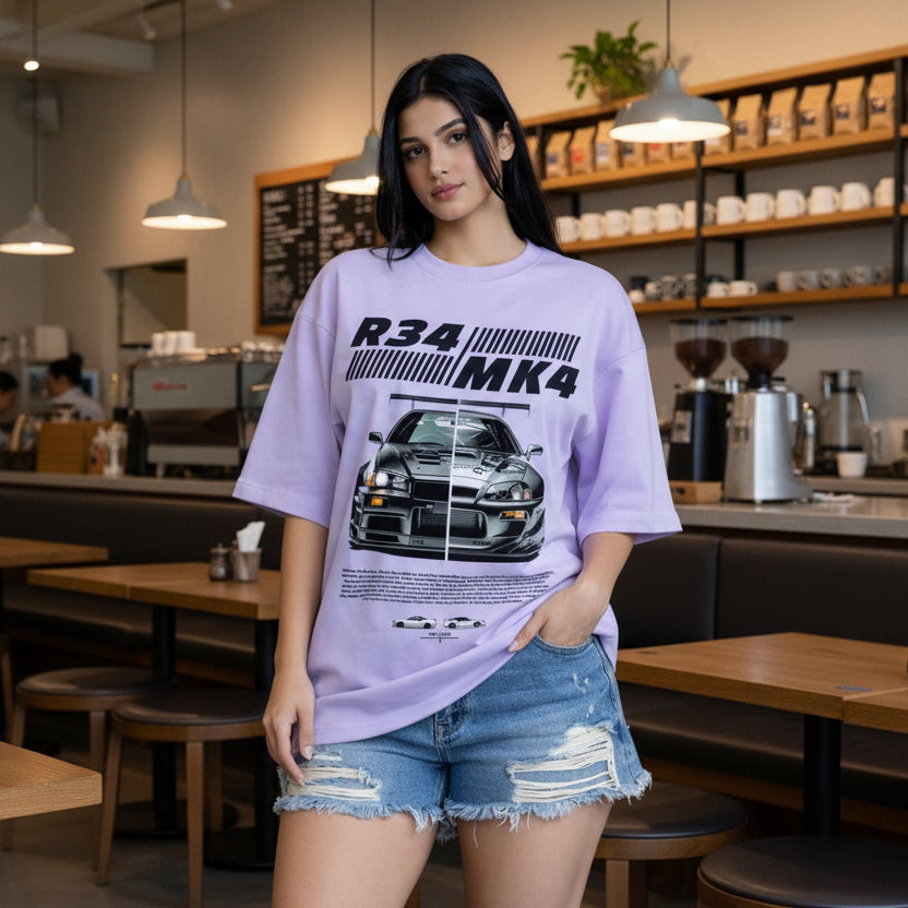 Person wearing a purple t-shirt with car design and text in an indoor setting