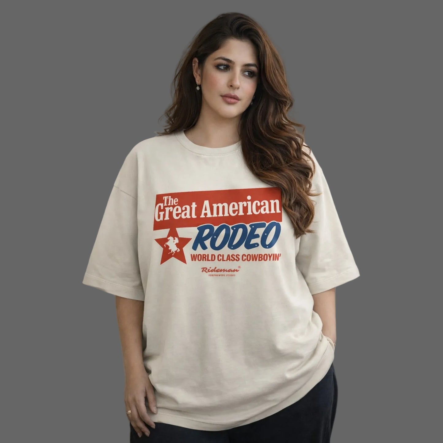 Woman wearing a 'The Great American Rodeo' t-shirt against a neutral background