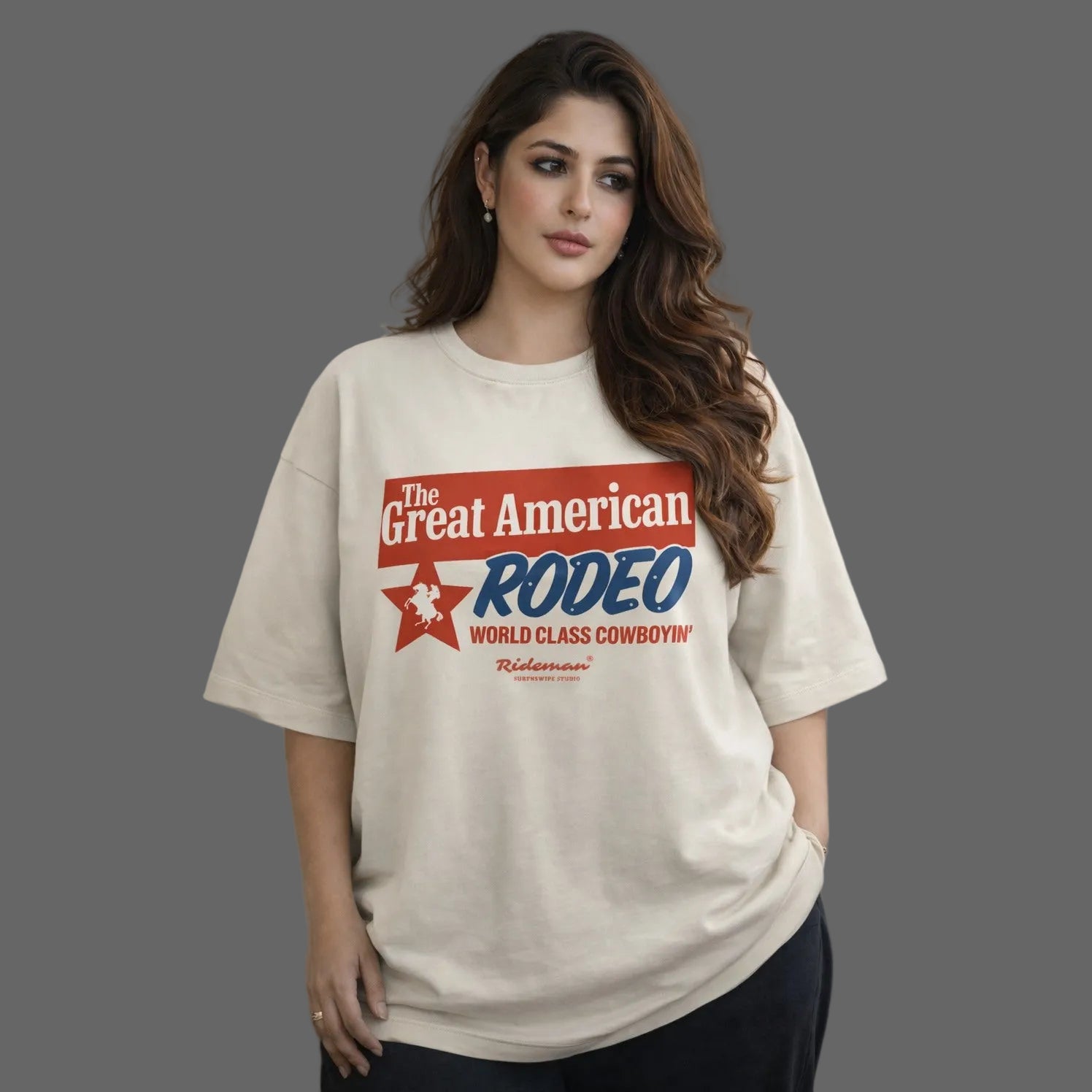 Woman wearing a 'The Great American Rodeo' t-shirt against a neutral background