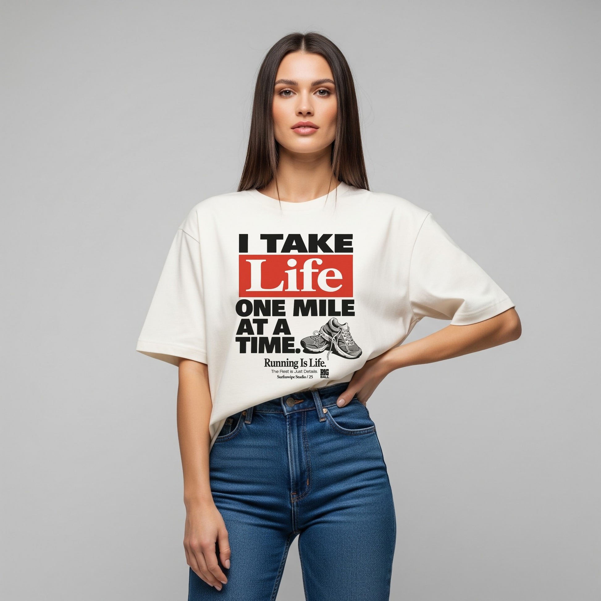 Woman wearing a white t-shirt with a motivational quote on a gray background