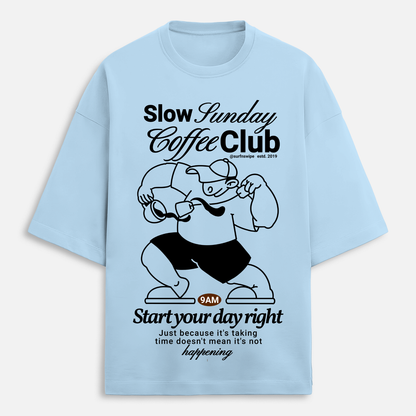 Light blue t-shirt with black graphic and text on a white background