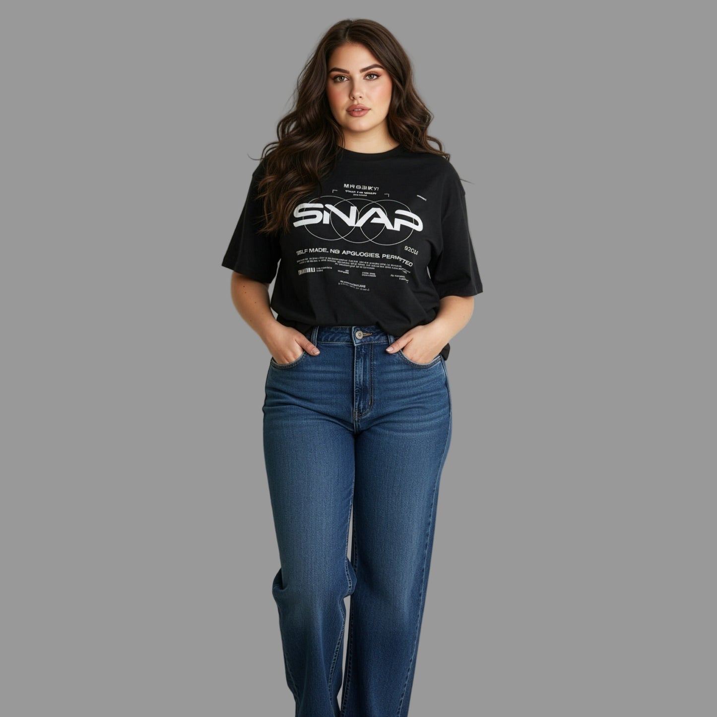 Woman wearing a black t-shirt with 'SNAP' logo and blue jeans against a plain background