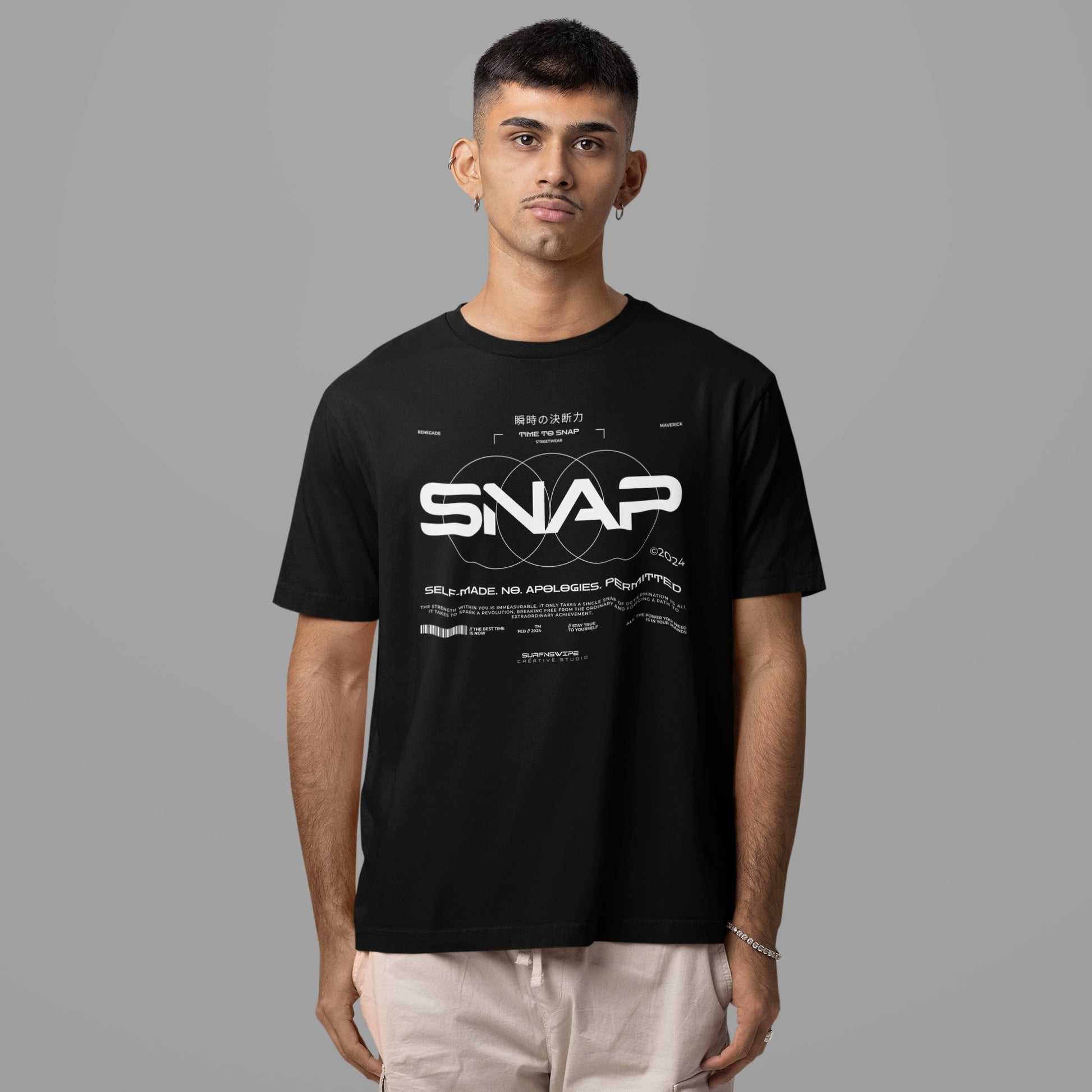 Person wearing a black t-shirt with 'SNAP' logo on a gray background