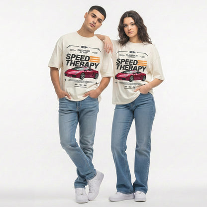 Two people wearing matching t-shirts with a car graphic and text on a plain background