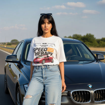 Woman wearing a 'Speed Therapy' t-shirt standing next to a BMW car on a road.