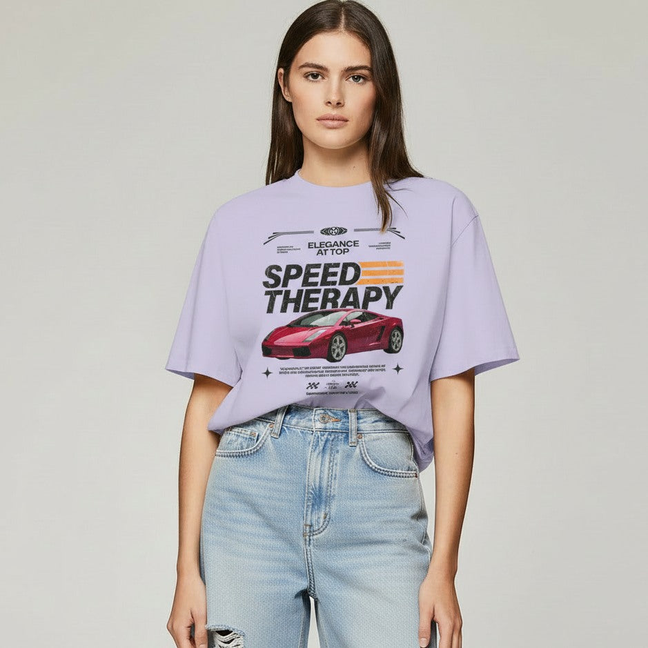 Woman wearing a purple t-shirt with a car graphic and text on a plain background