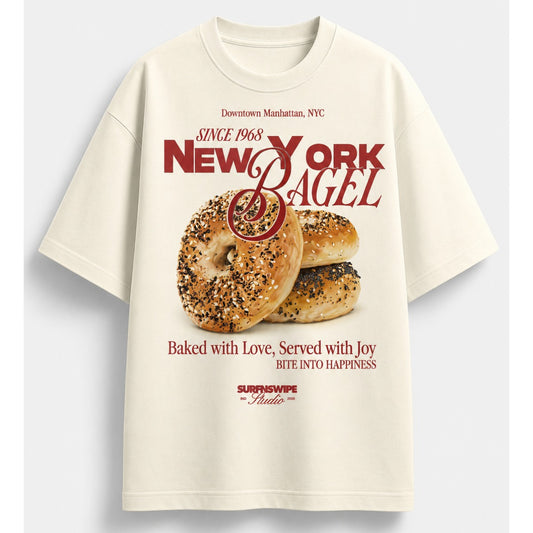 Beige t-shirt with New York bagel graphic and text on a light gray background