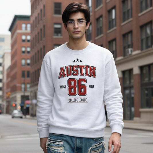 Man wearing a white sweatshirt with 'Austin 86' text on a city street.