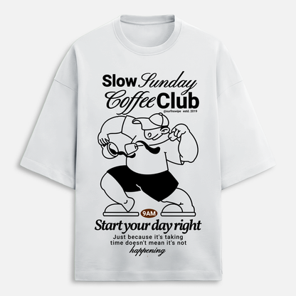 White t-shirt with black graphic and text 'Slow Sunday Coffee Club' on a white background