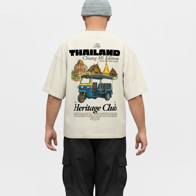 Person wearing a cream t-shirt with 'Thailand Chiang Mai Edition' design on a white background