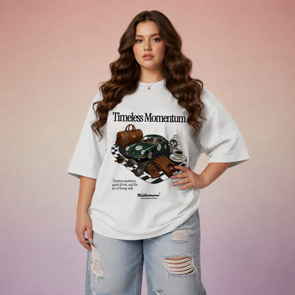 Woman wearing a white t-shirt with 'Timeless Momentum' graphic design on a gradient background