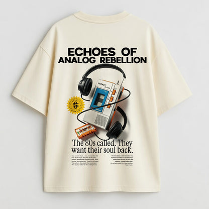 Beige t-shirt with retro-themed graphic and text on a light gray background