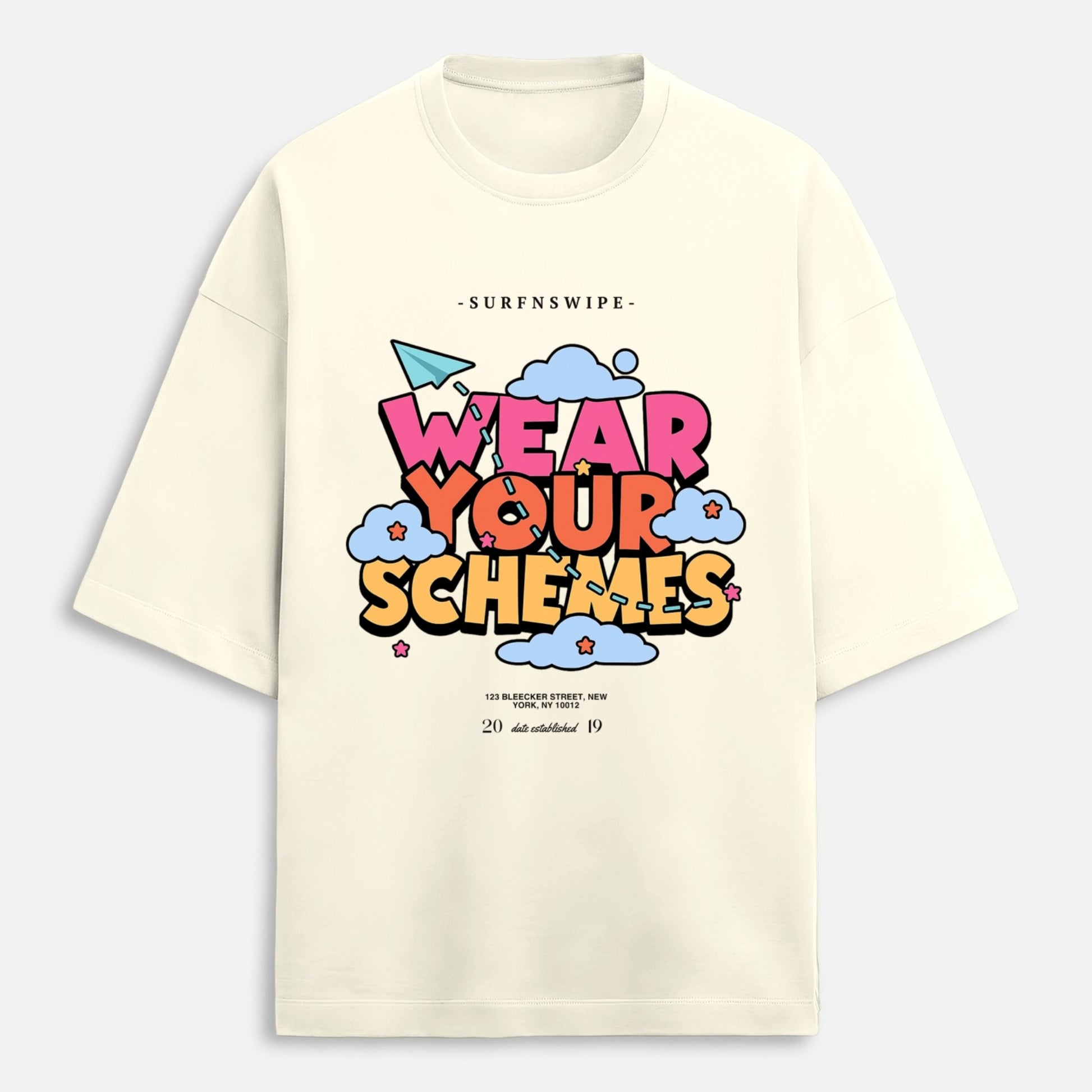 Off-white oversized cotton t-shirt flat lay showing full Wear Your Schemes retro cloud graphic print