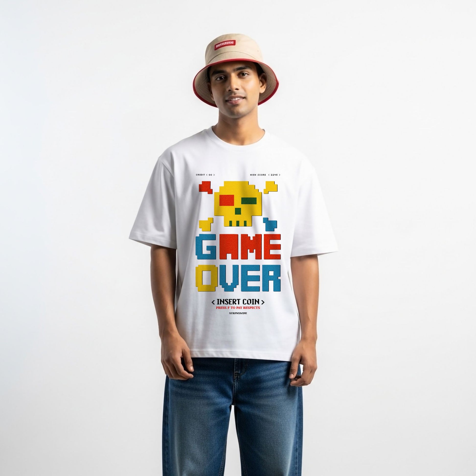 Man wearing a white t-shirt with 'Game Over' graphic design on a plain background