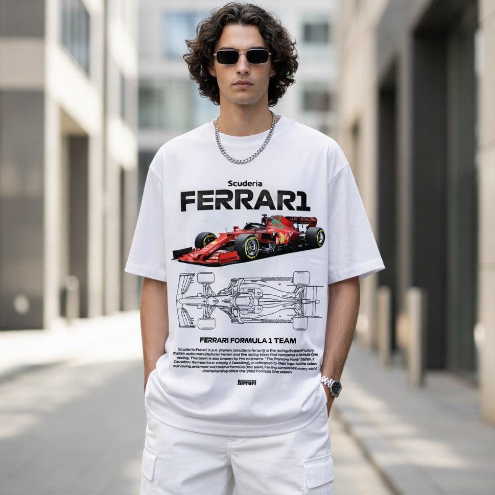 Person wearing a white Ferrari t-shirt with a Formula 1 car design on a city street.
