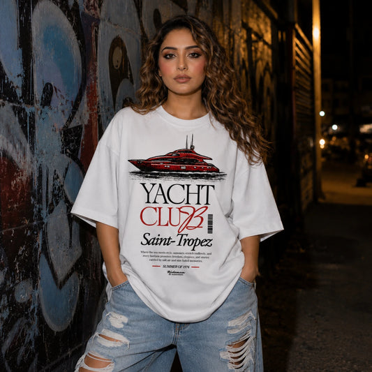 Woman wearing white Yacht Club Saint-Tropez oversized tee with ripped denim jeans
