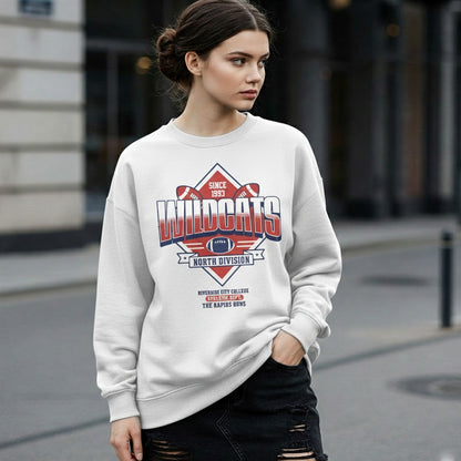 Woman wearing a white sweatshirt with 'Wildcats' design on a city street.