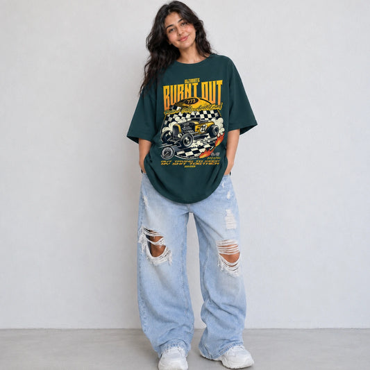 Woman wearing SURFNSWIPE Burnt Out Hot Rod oversized T-shirt in Petrol blue styled with ripped wide-leg jeans