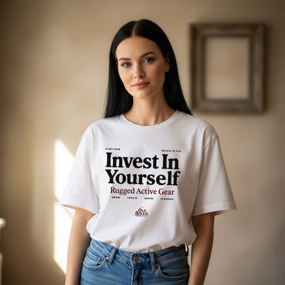 Woman wearing a white t-shirt with motivational text in a room.