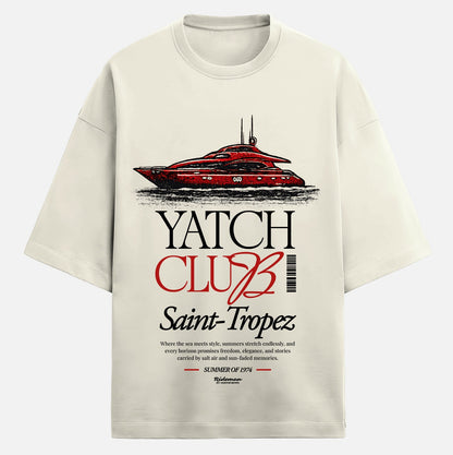 Beige t-shirt with red and black yacht graphic and text on a white background