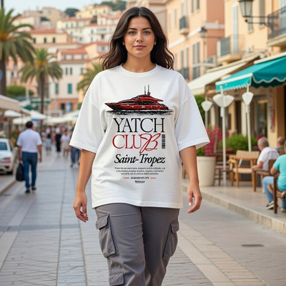 Woman wearing a 'Yatch Club Saint-Tropez' t-shirt on a city street.